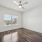 room with a ceiling fan and a window