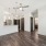 room with ceiling fan and white walls