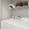 a white washing machine with a shelf on it