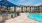 a pool in a courtyard with buildings in the background